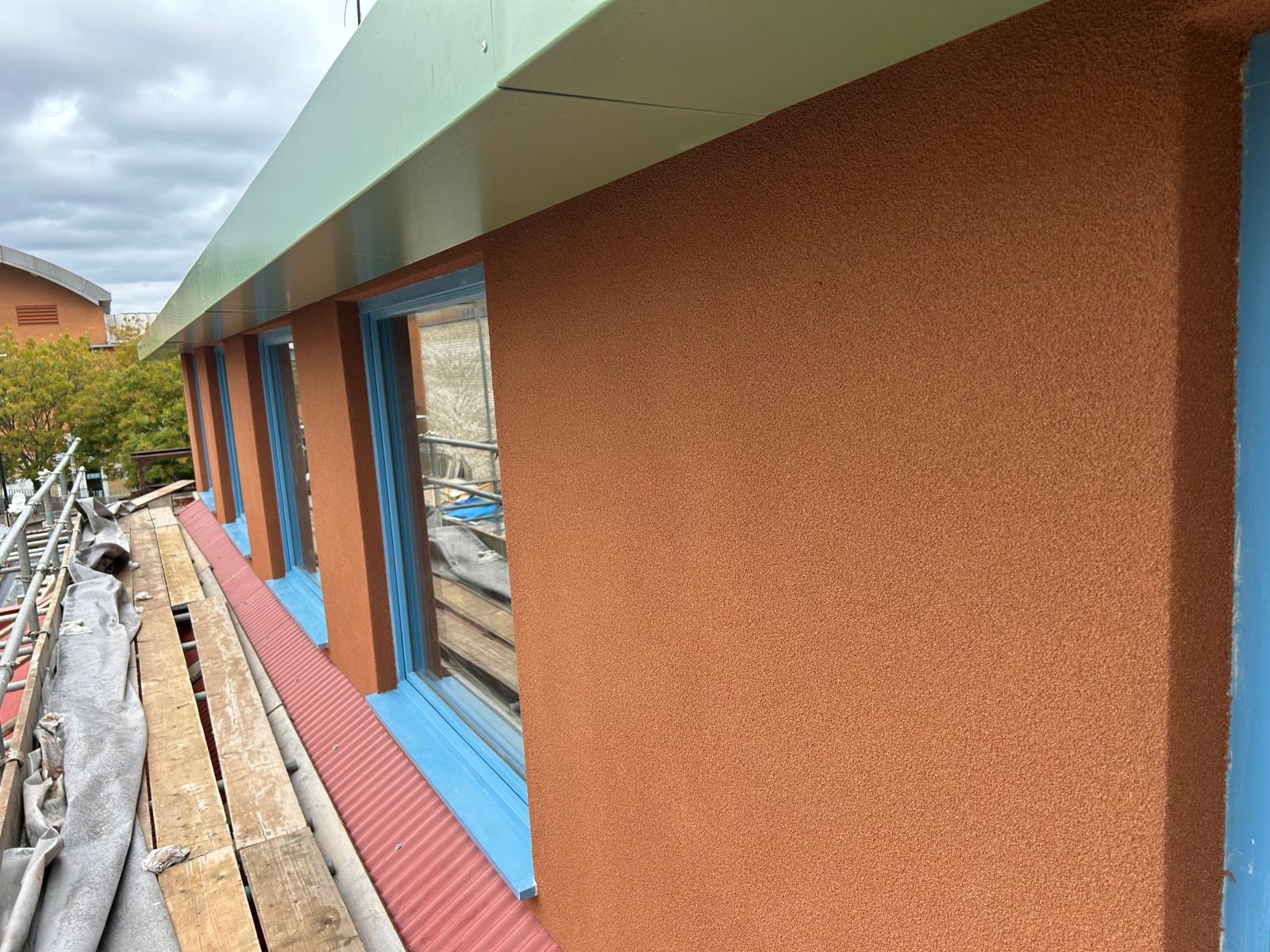 Exterior cork application by ALT Plastering Services Ltd