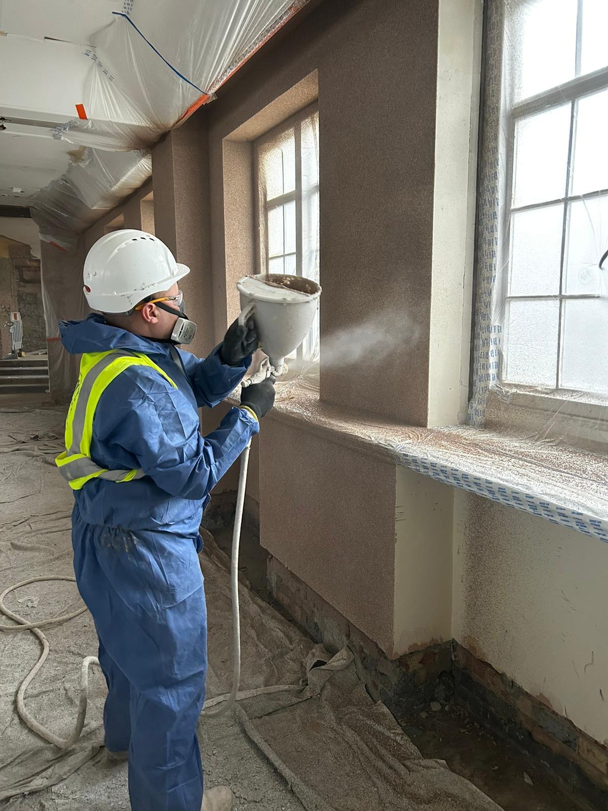 Spraying cork render on site by ALT Spray Cork